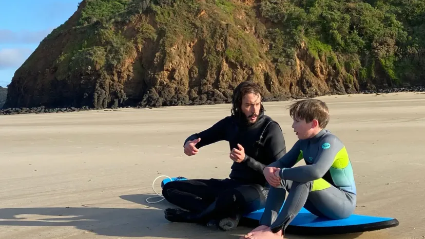 Pro Surf Coaching students carrying boards down to the water at Smiths Beach