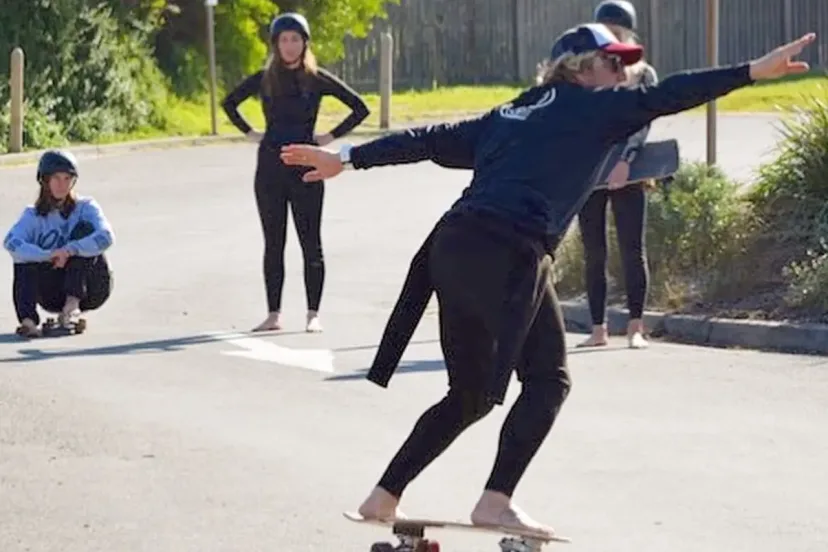 A coach running a surf presentation for a group
